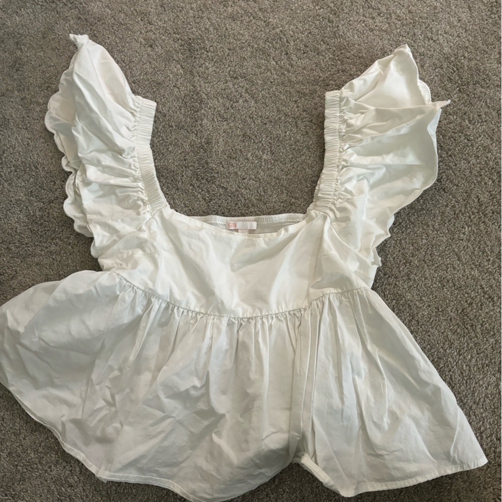 white top, puffy sleeves and puffy bottom half